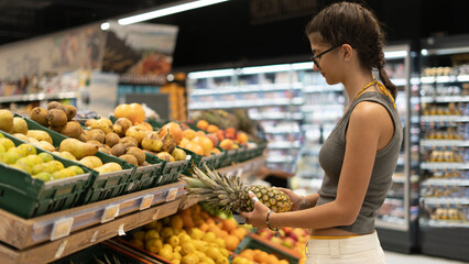 woman shopping vegetables in a supermarket
