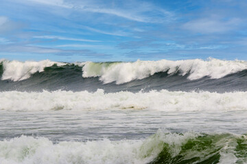 Large waves with white foam breaking from hurricaine ernesto