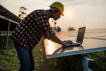 Male engineer working at high level to check efficiency of solar cell from clean solar cell which is friendly to environment.