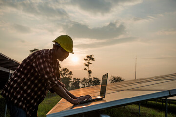 Male engineer working at high level to check efficiency of solar cell from clean solar cell which is friendly to environment.