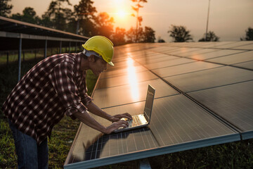 Male engineer working at high level to check efficiency of solar cell from clean solar cell which is friendly to environment.