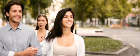 Cheating Boyfriend. Desperate Girl Meeting Her Man Dating With Other Woman Walking Outside In Park....