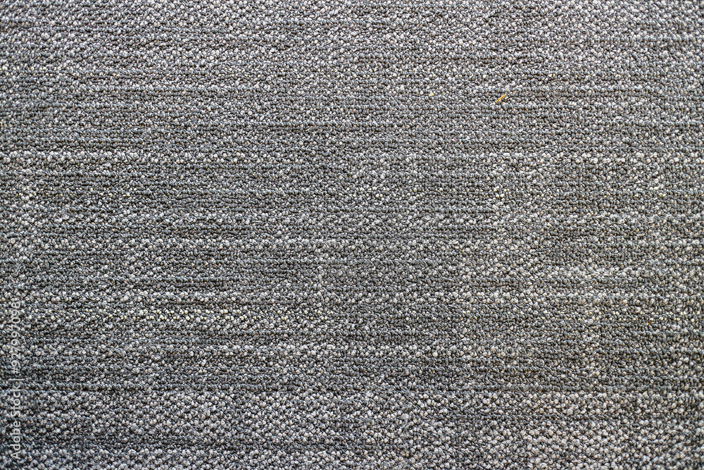 Poster a close-up shot of grey fabric texture, showing the weave and pattern of the material. close up of d