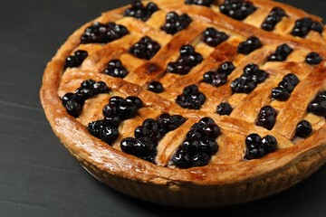 Tasty homemade pie with blueberries on grey table, closeup