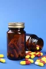 Pharmacist. Pills in plastic bottles on blue background