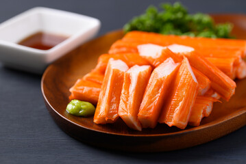 Crab sticks on wooden plate eating with wasabi and sauce © nungning20