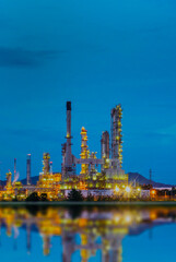 Obraz premium Vertical Oil refinery gas petrol plant industry with crude tank, gasoline supply chemical factory. Vertical horizontal Petroleum barrel fuel heavy industry oil refinery manufacturing factory plant