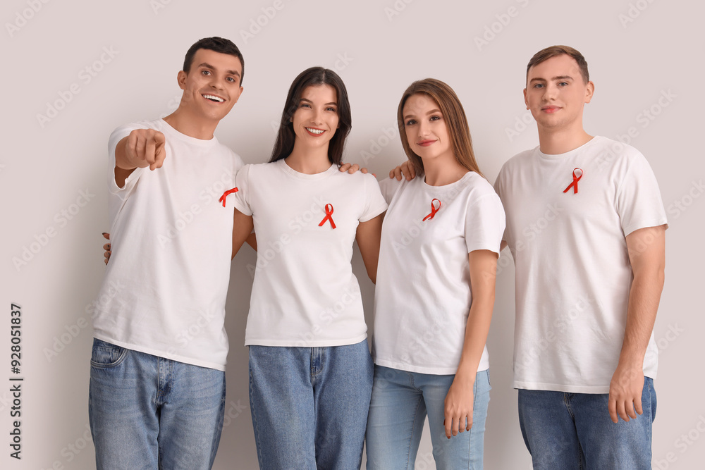 Sticker Group of young people with red ribbons on white background. World AIDS day concept