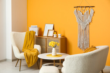 Beautiful interior of living room with white armchairs, cushion and coffee table