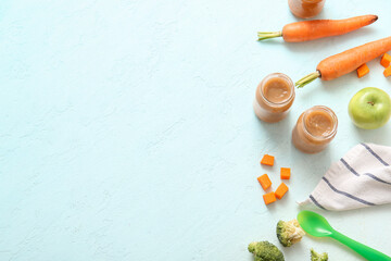 Composition with jars of healthy baby food and ingredients on light background