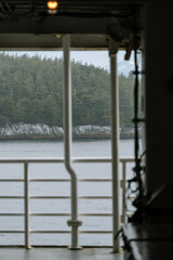 Fototapeta premium Alaska marine highway ferry along inside passage traveling from Washington to Alaska in summer 
