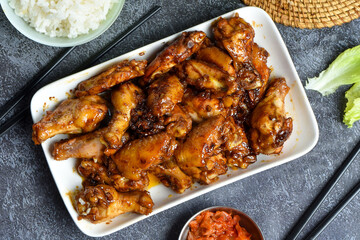 Asian style grilled chicken wings in soy-honey sauce