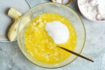 Mixing ingredients for cooking on gray background