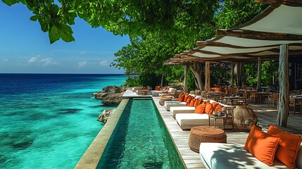 Relaxing poolside lounge chairs with ocean views and a tropical garden.