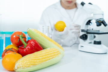 Scientist check chemical food residues in laboratory. Control experts inspect quality of fruits, vegetables. lab, hazards, ROHs, find prohibited substances, contaminate, Microscope, Microbiologist