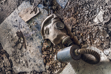 Old Dirty Gas Mask Lying On Messy Industrial Ground