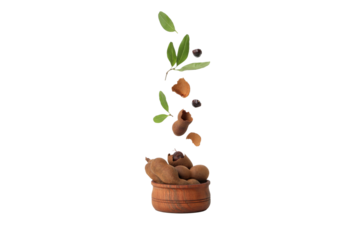 PNG, Ripe tamarind with leaves in a bowl, isolated on white background
