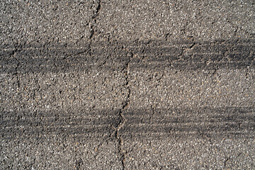 Traces of car tires on the road