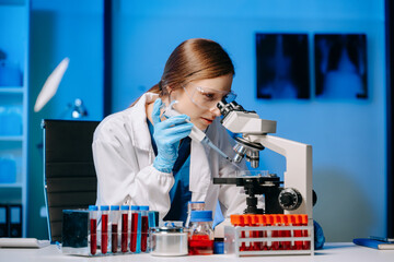 Female scientist working with micro pipettes analyzing biochemical samples, advanced science...