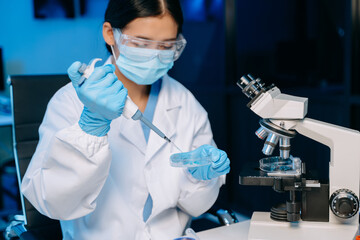 Female scientist working with micro pipettes analyzing biochemical samples, advanced science...
