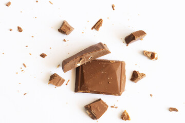 Broken chocolate bars isolated on white