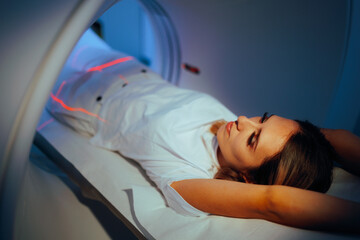 Patient Ready for an Abdominal CT Scan Evaluation. Woman undergoing for medical scan procedure in...