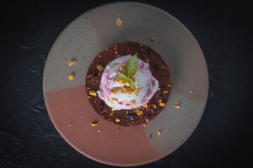 Scoops of ice cream on wooden background