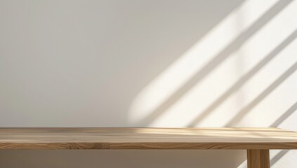 Wooden Tabletop with Sunlight Streaks on a White Wall