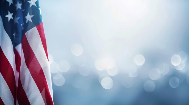 Realistic USA flag on blue blurry sky background