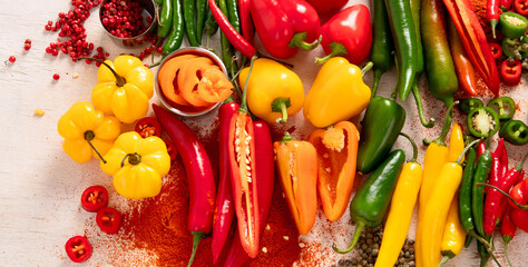 Peppers assorty on wooden background. Tasty vegetables. Colorful organic food.