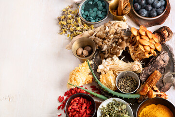 Healthy natural adaptogen. Herbs, spices, mushrooms on light background. Nervine food collection