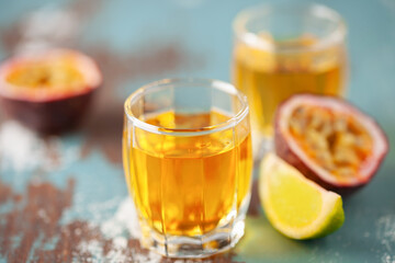 Passion Fruit Liqueur in shot glasses. Tropical natural drink