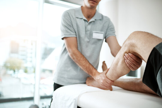 Calf, man or physiotherapist with leg rehabilitation in office for knee injury for orthopedic support. Small business, mobility help or professional pt with physiotherapy service for muscle recovery