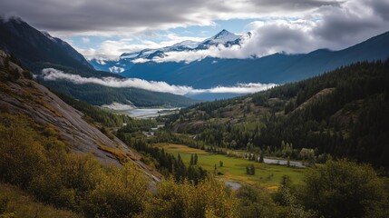 Naklejka premium Breathtaking Mountain Landscape with Lush Valley and Water