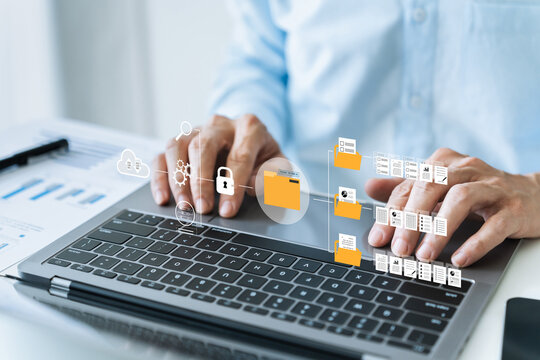 Businessman working on directory or index of business and financial paperless report file, contract, plan, data and information via laptop. E-document management software system workflow office