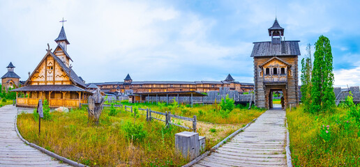 Panorama with wooden church and fortifications of Kyiv Rus Park, Ukraine