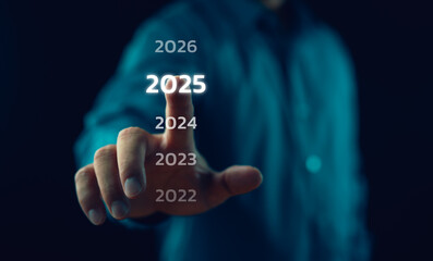 Happy New Year 2025, Hand touch on a virtual screen 2025, New Goals, Plans, and numbers for Next Year, Businessman touching future growth year 2024 to 2025, Planning, opportunity, business strategy.