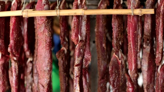 Strips of cured and spiced kudu game meat rotating on wheel to dry by fan