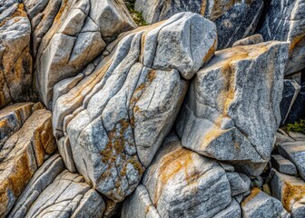 Weathered granite rock formation exhibits a mesmerizing mix of deep grays, speckled with hints of silver, creating a striking natural abstract pattern.