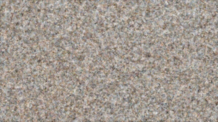 Close-up view of textured sand grain on a beach during daylight hours