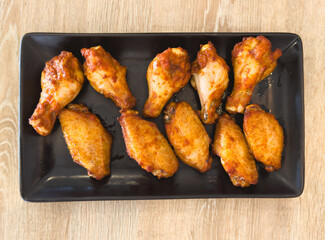 Fried chicken legs on a baking sheet