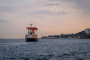 Freight ship sails along the Bosphorus off Istanbul's coast, capturing 