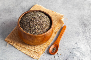 chia seeds on an wooden bowl, good antioxidants. healthy body. super food. 