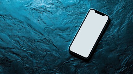 Modern smartphone with blank screen on a blue textured background.