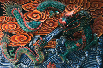 Intricate dragon mural at an authentic temple in Singapore showcasing vibrant colors and detailed craftsmanship