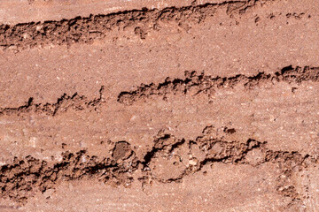 Crushed tan colored facial loose powder texture background. Top view
