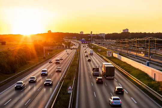 Germany, Baden-Wurttemberg, Stuttgart, Traffic on Bundesautobahn 8 at sunset