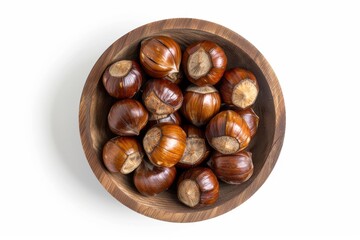 Chestnuts in wooden bowl on white background viewed from above