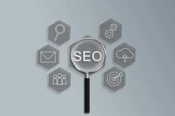 Magnifying glass focus on Search Engine Optimization (SEO) concept. Businessman user laptop to...