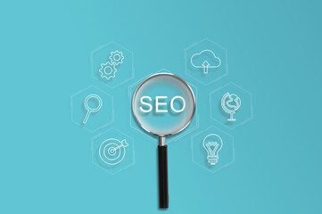 Magnifying glass focus on Search Engine Optimization (SEO) concept. Businessman user laptop to...